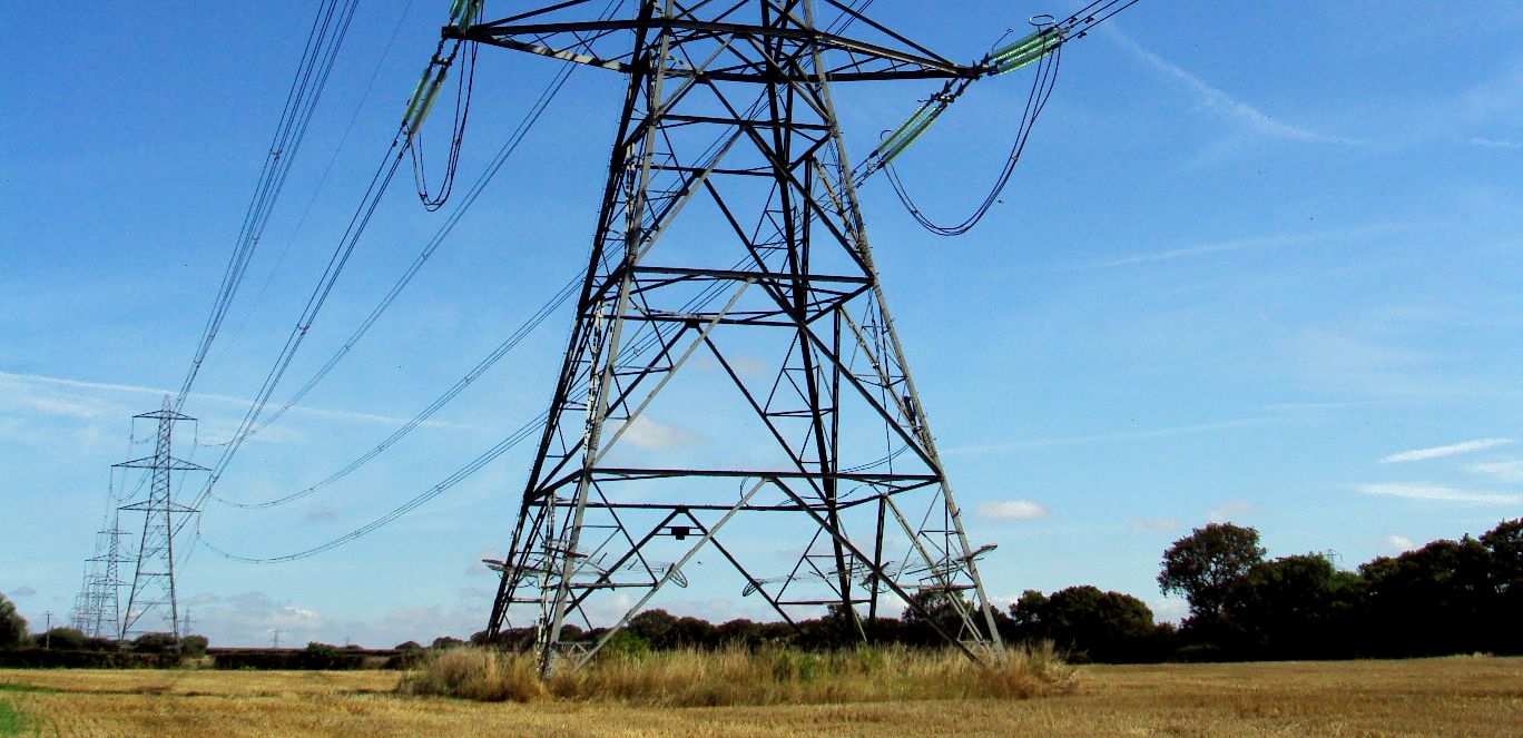 Electricity pylons carrying energy to power the world